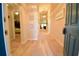 Inviting home entryway with beach themed decorations and neutral paint, featuring a view into other rooms at 12820 Bent Twig Dr, Riverview, FL 33579