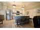 Well-lit kitchen features stainless steel appliances, stylish pendant lights, and a center island with seating at 12820 Bent Twig Dr, Riverview, FL 33579
