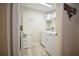 Convenient laundry room equipped with washer, dryer, and storage cabinets at 12820 Bent Twig Dr, Riverview, FL 33579