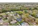 Aerial view of the neighborhood showing mature trees and a mix of smaller and larger homes at 15639 Bear Creek Dr, Tampa, FL 33624