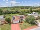 Features solar panels, a colorful driveway, and views of the surrounding green landscape and waterways at 1629 Dartmouth Dr, Holiday, FL 34691