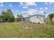 Expansive backyard showcasing lush greenery and a beautifully maintained lawn at 1629 Dartmouth Dr, Holiday, FL 34691