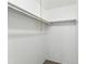 Walk-in closet features ample hanging space for storage at 1629 Dartmouth Dr, Holiday, FL 34691