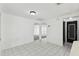 Open concept dining area with tile floors leads to living spaces and bedrooms at 1629 Dartmouth Dr, Holiday, FL 34691