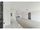 Bright entryway with tile flooring leading to an expansive, carpeted living space at 1629 Dartmouth Dr, Holiday, FL 34691