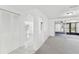 Hallway with archways leading into the kitchen and living room area at 1629 Dartmouth Dr, Holiday, FL 34691