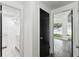 Hallway between bathroom and bedroom with contrasting black door at 1629 Dartmouth Dr, Holiday, FL 34691