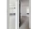 Hallway showing access to rooms with neutral carpet and views to enclosed patio space at 1629 Dartmouth Dr, Holiday, FL 34691