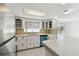 Bright kitchen with a vintage blue dishwasher and white cabinetry at 1629 Dartmouth Dr, Holiday, FL 34691