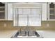 Kitchen sink with a view of the outside at 1629 Dartmouth Dr, Holiday, FL 34691