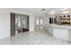 Open concept living space with tile flooring, seamless flow to other rooms, and abundant natural light at 1629 Dartmouth Dr, Holiday, FL 34691