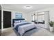 Cozy main bedroom featuring stylish decor, access to patio and bright, neutral paint at 1629 Dartmouth Dr, Holiday, FL 34691