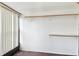Walk-in closet with built-in shelving and ample storage space; features vertical window blinds at 1629 Dartmouth Dr, Holiday, FL 34691