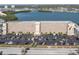 An aerial view of the high-rise complex shows ample parking and convenient access, set against a backdrop of waterways at 1847 Shore S Dr # 215, South Pasadena, FL 33707