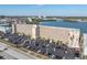 An aerial view of the waterfront complex features a large parking area and convenient access to nearby city amenities at 1847 Shore S Dr # 215, South Pasadena, FL 33707