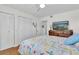 Bedroom featuring light wood floors, white walls, and a closet at 1847 Shore S Dr # 215, South Pasadena, FL 33707