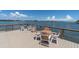 Community deck with seating area offers stunning views of the surrounding waterway at 1847 Shore S Dr # 215, South Pasadena, FL 33707