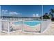 Fenced in community pool with an adjacent kiddie pool overlooks the waterway at 1847 Shore S Dr # 215, South Pasadena, FL 33707