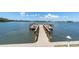 Community dock extends into the water, offering a scenic spot for relaxation and enjoyment of waterfront views at 1847 Shore S Dr # 215, South Pasadena, FL 33707