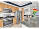 A stainless-steel oven and refrigerator are featured in this cozy kitchen at 1847 Shore S Dr # 215, South Pasadena, FL 33707