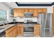 Bright kitchen features stainless steel appliances, and stone countertops at 1847 Shore S Dr # 215, South Pasadena, FL 33707
