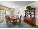 Bright dining room with a wooden dining table, chandelier, and a classic hutch at 2025 E View Dr, Sun City Center, FL 33573