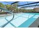 Sun-drenched, screened-in pool with crystal-clear water, and easy access from the home's interior at 2025 E View Dr, Sun City Center, FL 33573