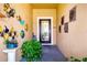 Bright entryway featuring coastal-themed decor, textured walls, and a glass-paneled front door at 2831 Santego Bay Ct, Brandon, FL 33511