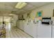 Well-maintained laundry room with multiple machines for convenience at 2983 Flint S Dr, Clearwater, FL 33759