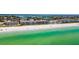 Aerial shot of beachfront condos with direct beach access and beautiful turquoise water at 3100 Gulf Blvd # 134, Belleair Beach, FL 33786