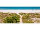 Scenic beach view with lush dunes, offering a tranquil escape to the sandy shore at 3100 Gulf Blvd # 134, Belleair Beach, FL 33786