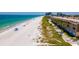 Aerial of beautiful beach and condo with ocean access and walking path at 3100 Gulf Blvd # 134, Belleair Beach, FL 33786