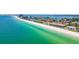 Amazing aerial view of beach and condo with city scape in the distance at 3100 Gulf Blvd # 134, Belleair Beach, FL 33786