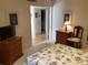 Cozy bedroom features coastal-themed bedding and decor with hardwood furniture, exuding a relaxing and inviting space at 3100 Gulf Blvd # 134, Belleair Beach, FL 33786
