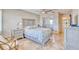 Comfortable bedroom with tile flooring, a ceiling fan, and ample storage at 3100 Gulf Blvd # 134, Belleair Beach, FL 33786