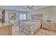 Cozy bedroom with neutral decor, tiled floor, and ceiling fan at 3100 Gulf Blvd # 134, Belleair Beach, FL 33786