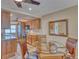 Open-concept kitchen adjacent to dining area, featuring wood cabinets and stainless steel appliances at 3100 Gulf Blvd # 134, Belleair Beach, FL 33786