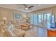 Relaxing living room with sliding glass doors leading to a balcony at 3100 Gulf Blvd # 134, Belleair Beach, FL 33786