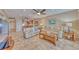 Bright living room boasts tile floors, a ceiling fan, and comfortable seating at 3100 Gulf Blvd # 134, Belleair Beach, FL 33786