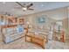 Inviting living room features neutral tones, tile flooring, and a ceiling fan at 3100 Gulf Blvd # 134, Belleair Beach, FL 33786