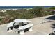 Outdoor seating area with a table and benches, ideal for picnics and enjoying the scenic surroundings at 3100 Gulf Blvd # 134, Belleair Beach, FL 33786