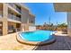 Community pool featuring a shallow end and lounge chairs at 3100 Gulf Blvd # 134, Belleair Beach, FL 33786