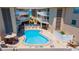 Resort-style pool area featuring ample seating, a well-maintained pool deck, and convenient access to the building at 3100 Gulf Blvd # 134, Belleair Beach, FL 33786