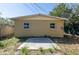 This home's backyard has a simple concrete patio and plenty of space for outdoor activities at 3235 6Th S Ave, St Petersburg, FL 33701
