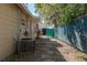 Home's backyard features an AC unit and a walkway leading to a fenced area at 3235 6Th S Ave, St Petersburg, FL 33701