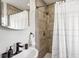 Bathroom featuring a sleek vanity and walk-in shower at 3316 W Ballast Point Blvd, Tampa, FL 33611