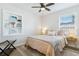 Comfortable bedroom with a neutral color scheme, natural lighting, and a decorative built-in shelf at 3316 W Ballast Point Blvd, Tampa, FL 33611