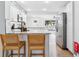 Bright, airy kitchen with granite countertops, modern stainless appliances, and stylish bar seating at 3316 W Ballast Point Blvd, Tampa, FL 33611