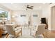 Bright living room featuring neutral decor, a ceiling fan, and cozy furnishings at 3316 W Ballast Point Blvd, Tampa, FL 33611