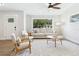 Inviting living room featuring neutral colors, large windows, and comfortable seating at 3316 W Ballast Point Blvd, Tampa, FL 33611